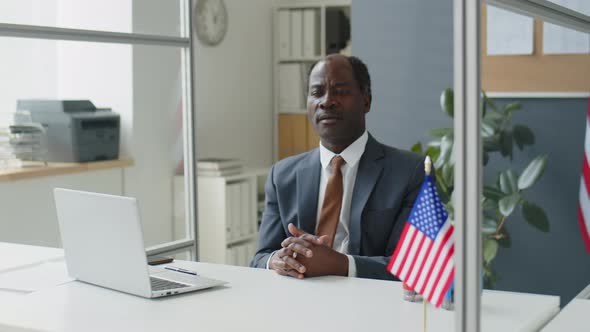 Black Visa Officer Working with Applicants in U.S. Embassy