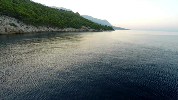 Rocky Mediterranean Coastline With Pine Trees