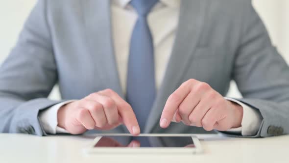 Close Up of Businessman Using Digital Tablet