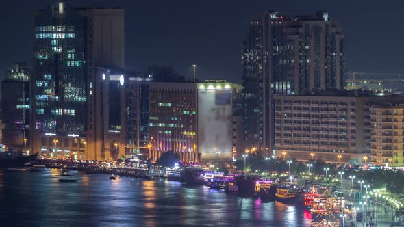 Dubai Creek Landscape Night Timelapse with Boats and Ship Near Waterfront