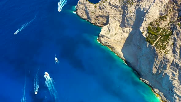 Greece. Aerial seascape at the day time. Sea bay and rocks from drone. Blue water background