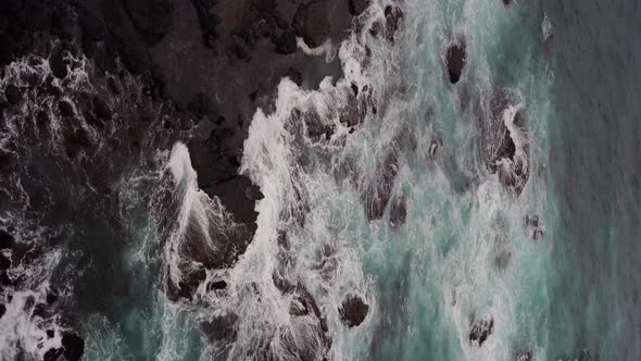 Vertical Footage of beautiful blue ocean waves crashing the rocky shore at Loch Ard Gorge 12 Apostle