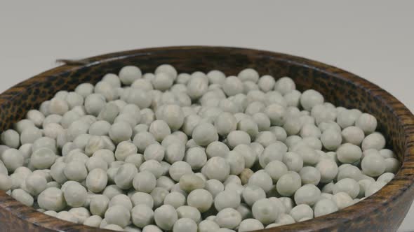 Green Peas in Wooden Bowl