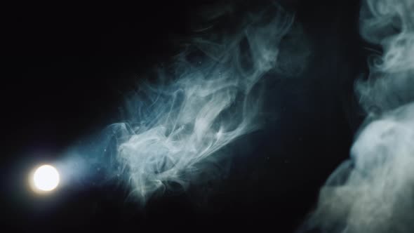 Lantern Illuminates Smoke on a Black Background