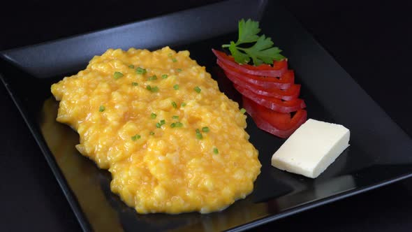 Pumpkin porridge with rice, milk and sugar in plate rotate, organic food