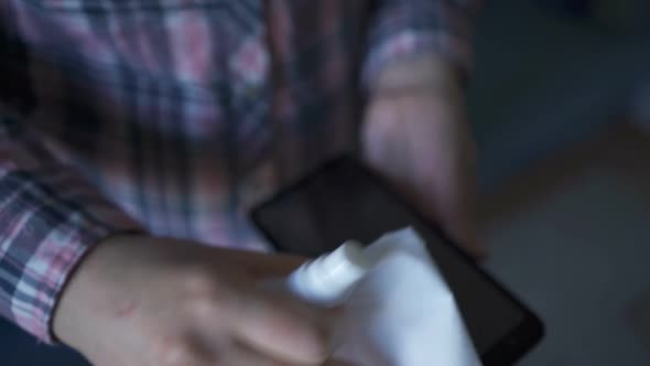 Disinfection of Mobile Phone with Antiseptic Spray and Napkin.