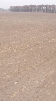 Vertical Video of a Field with Plowed Land in Autumn Slow Motion