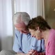 Senior Couple Looking at Photograph Album - VideoHive Item for Sale