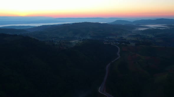 4K High mountain road in fog. Tropical forest with smoke and fog.