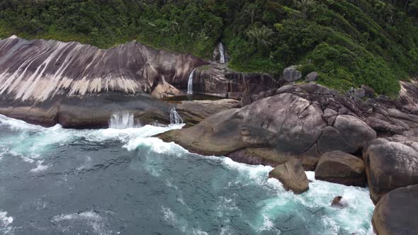 scenic waterfall in front of the sea in Paraty - Rio de Janeiro, Brazil. The amazing Saco Bravo casc