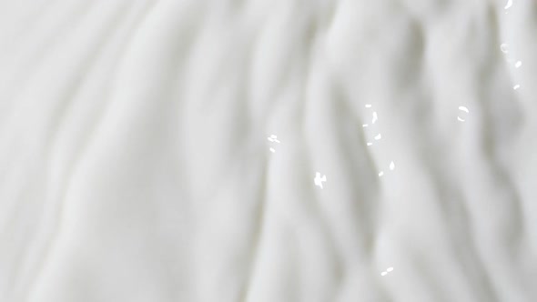 Slow Motion White Liquid Cream Ripples Closeup Fresh Milk Drink Splash Texture