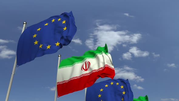 Waving Flags of Iran and the EU on Sky Background