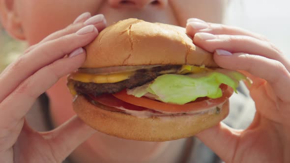 Happy Smiling Woman Eating Delicious Juicy Delicious Cheeseburger RED Footage