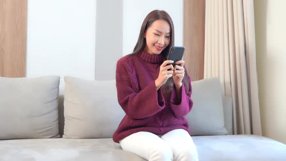 Young asian woman use smart phone