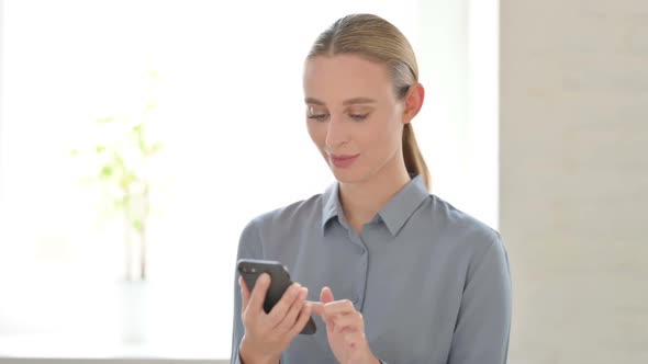 Portrait of Woman Browsing Internet on Smartphone