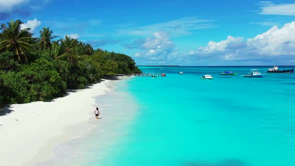 One woman suntans on paradise seashore beach adventure by blue water with white sandy background of 