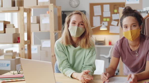 Portrait of Two Female Coworkers in Face Masks