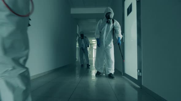 Disinfectors Clean a Hallway To Kill Coronavirus