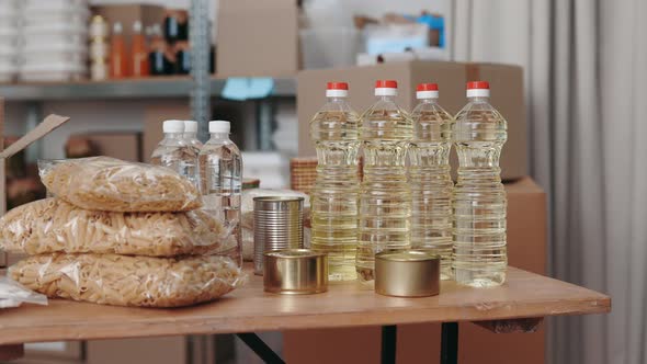 Bottles of Water Oil Pasta and Canned Product at Food Bank