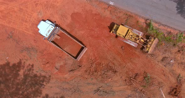 Aerial View of Large Construction Site with Several Crawler Excavator Machines in Moving Earth It