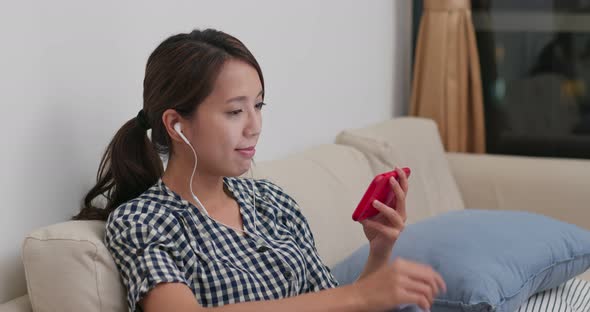 Woman use of mobile phone at home