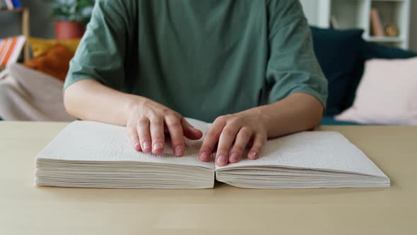 Blindman Reading Braille Book Using His Fingers Sitting in Living Room Poorly Seeing Person Learning