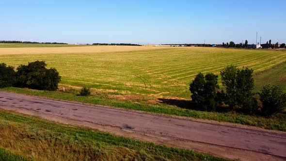 Aerial drone view of a flying over the rural agricultural landscape.