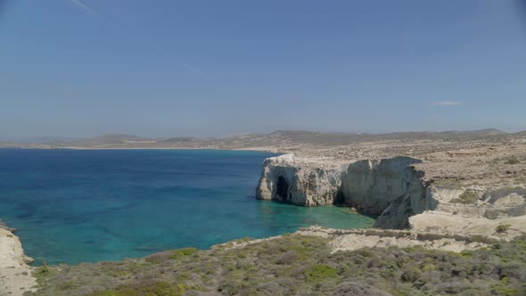 Aerial Pan of Caves of Milos on the Aegean Sea Cyclades Islands Greece