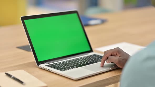 African Man Using Laptop with Chroma Screen