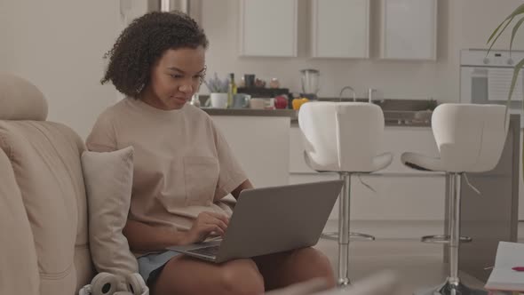 Biracial Girl Studying on Laptop from Home