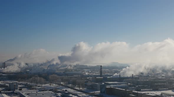 White smoke or steam issues from the factory chimneys in cold frosty weather