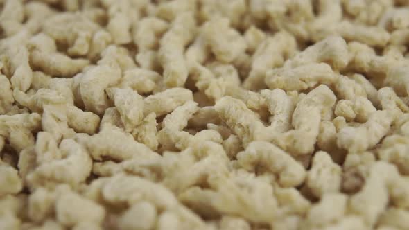 Uncooked textured dried soy flakes