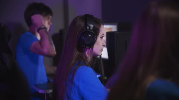 Group of Friends Playing an Online Game in the Computer Club