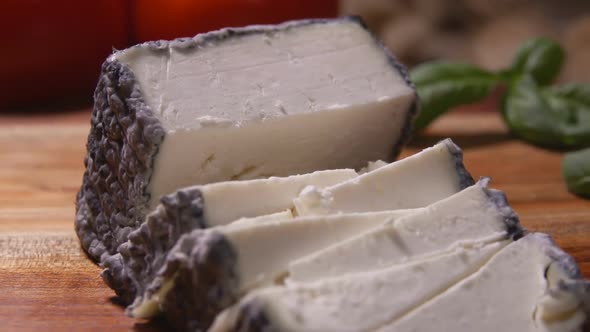 Double Tooth Fork Takes Piece of Soft Goat Cheese