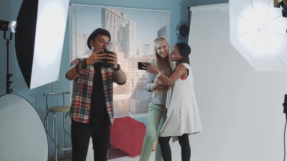 Black Model with Make-up Artist Making Selfie While Photographer Together Photos of Them