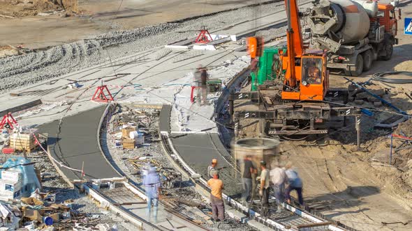 Concrete Works for Road Construction with Many Workers and Mixer Timelapse