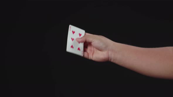 Magician Shows Trick With Playing Cards. Manipulation With Props. Sleight Of Hand
