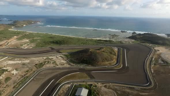 Aerial Circuit Mandalika with cloud and beach background in Lombok