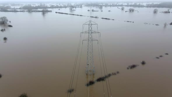 An Electricity Pylon in Deep Water in a Floodwaters Causing Power Outages 