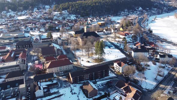 Kongsberg city aerial flying southwest towards Kongsberg Church - Sunny winter morning close to nume