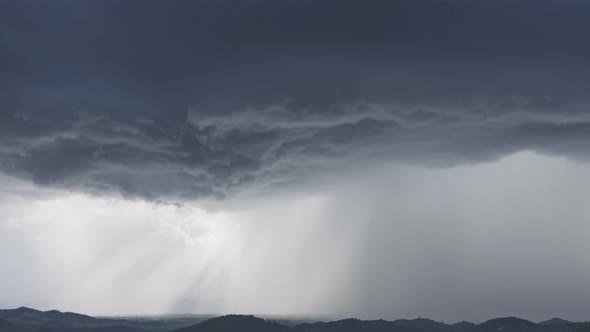 Storms and black clouds moving over the mountains.