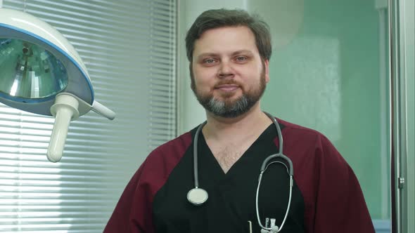 Confident Doctor Smiles Into Camera