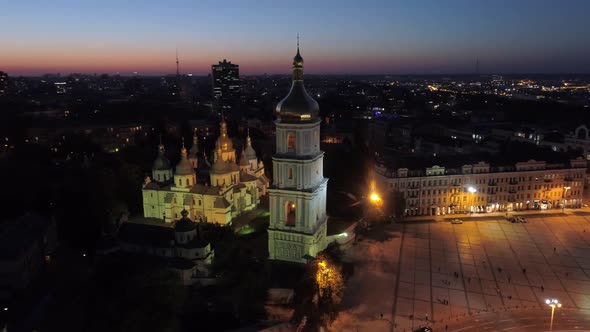 Orthodox Sophia Cathedral and Bell Tower with Night Illumination. Aerial Drone Shot