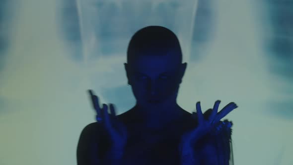 Man Dancing in Studio with Light Projection