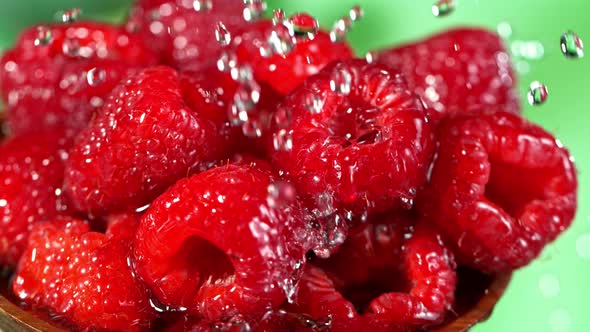 Super Slow Motion Shot of Splashing Water on Fresh Raspberries at 1000Fps