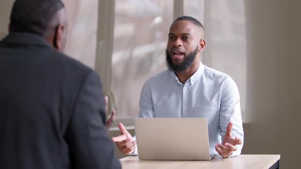 Successful Handsome African Male Business Man with Laptop Talk Angry with Unrecognizable Partner