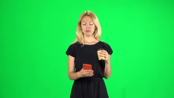 Cute Girl Goes and Speaks By Phone While Drinking a Coffee. Chroma Key