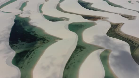 Sand dunes mountains and rain water lagoons at northeast brazilian paradise.