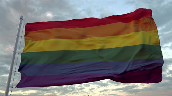 LGBT Pride Flag Waving in the Wind Against Deep Beautiful Sky