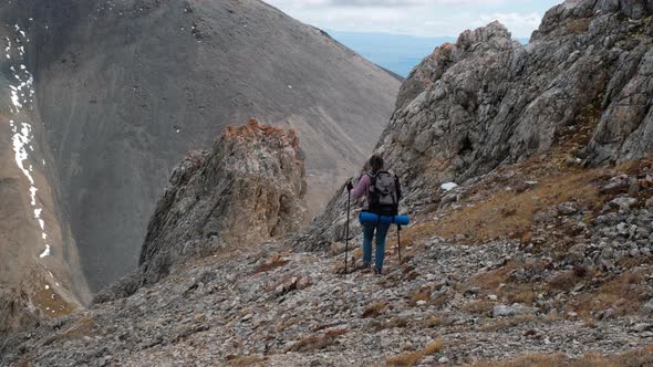 Young Woman Traveler Hiking Around Mountains